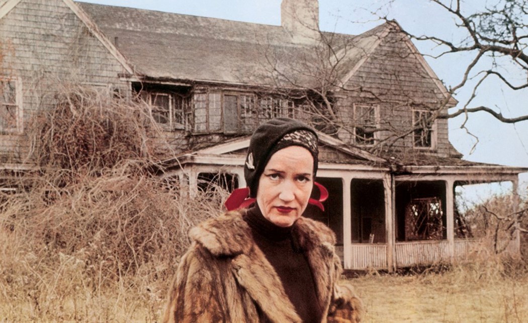 Photo of Little Edie Beale in front of Grey Gardens, copyright 1975 Albert and David Maysles