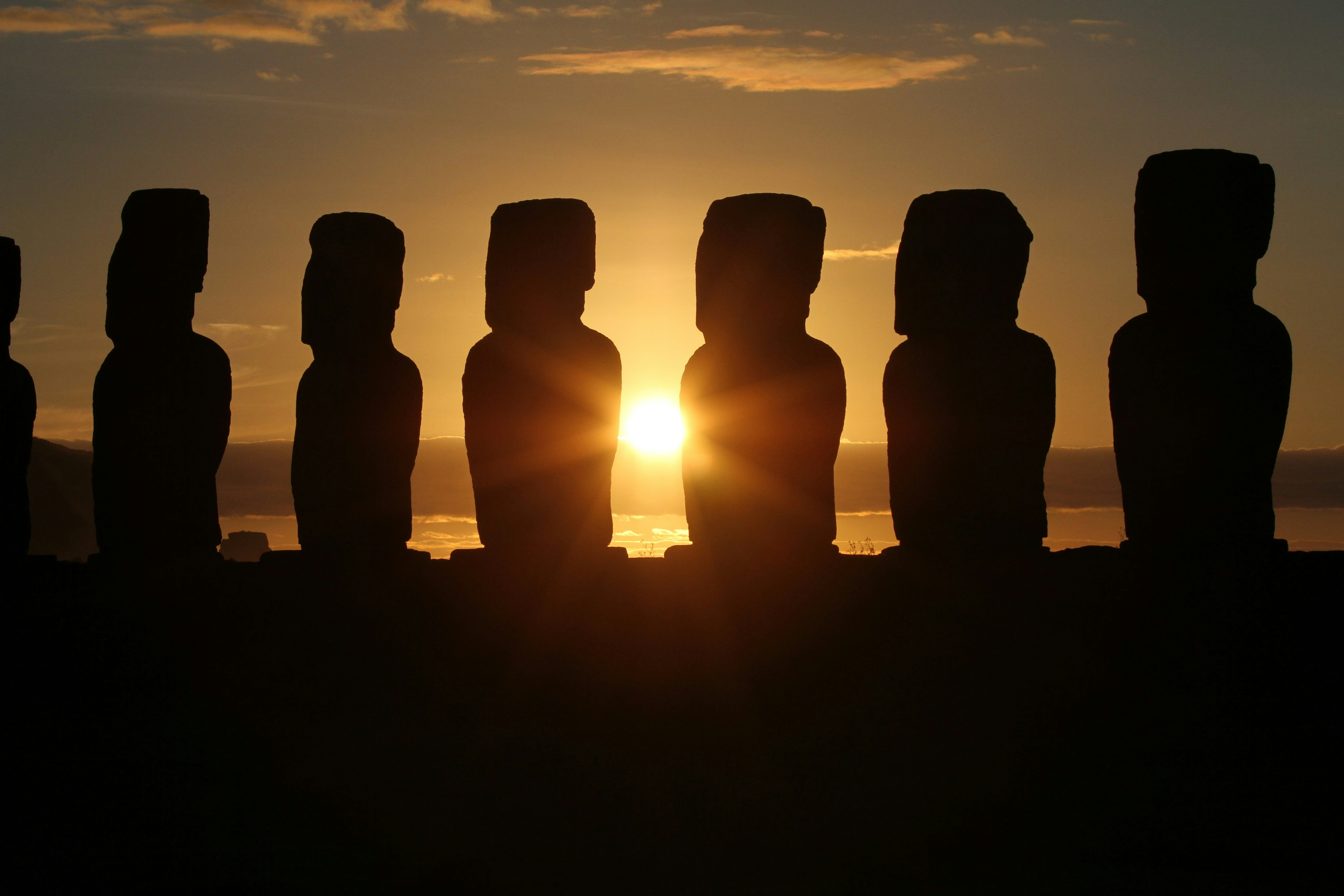 an image of easter island and the silhouette of the statues