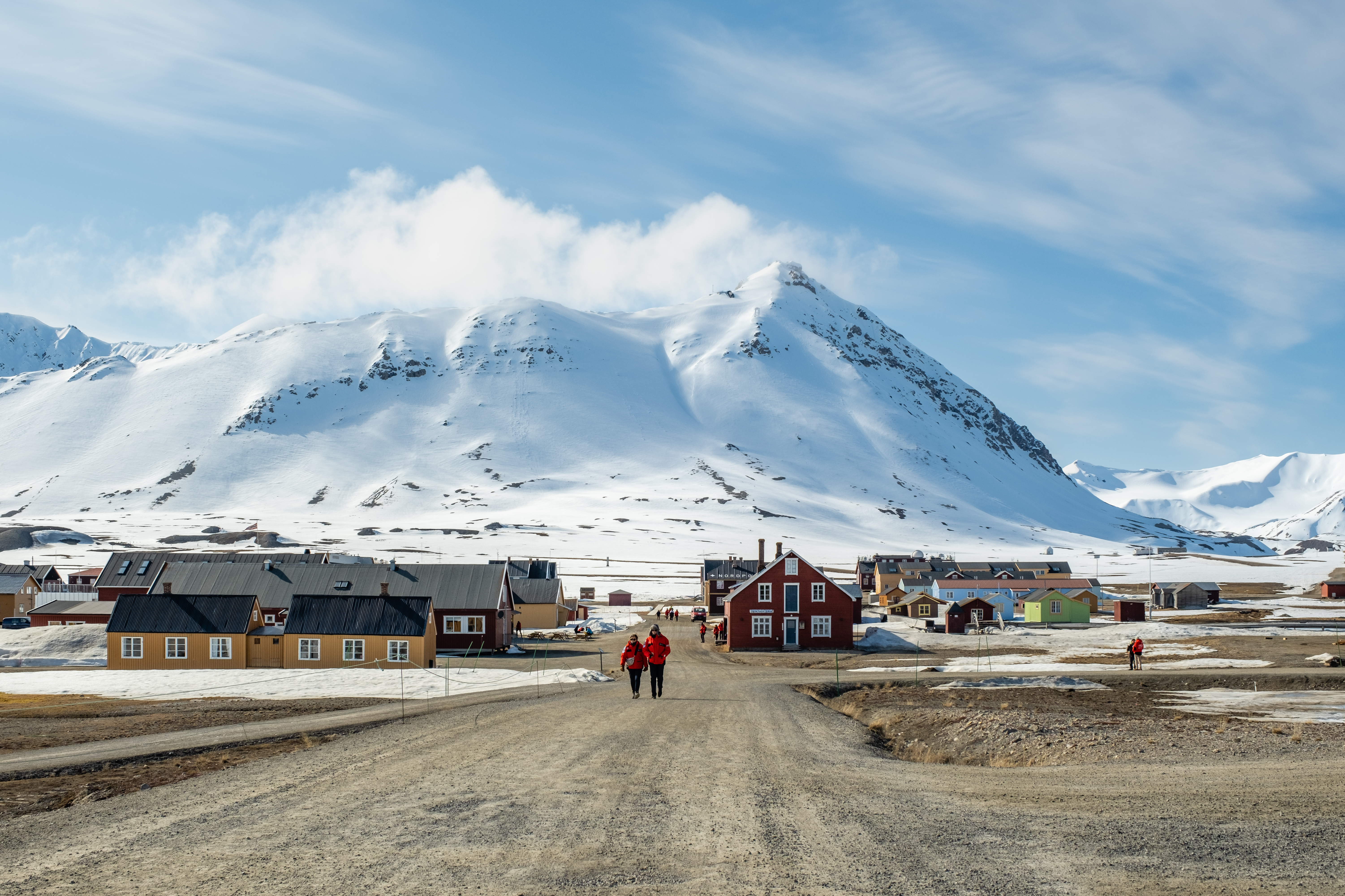 an image of svalbard, norway that is filled with ice and small buildings that are isolated